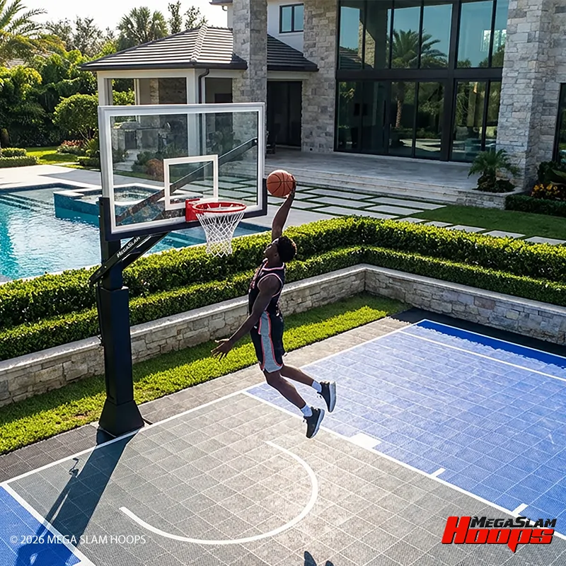 Player dunking on a Mega Slam hoop over a tiled backyard basketball court