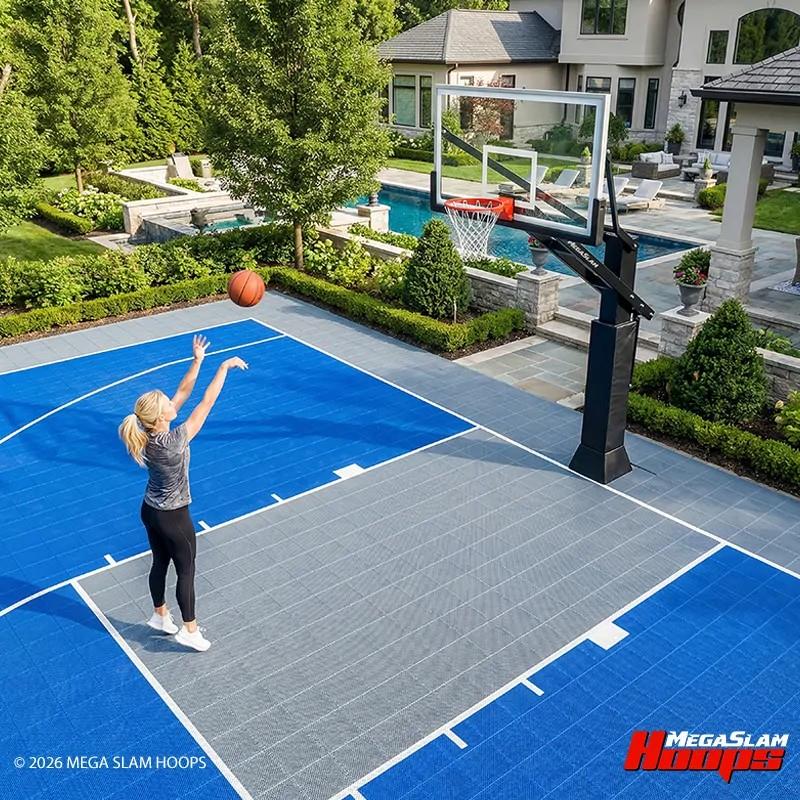 Home basketball court with sport tiles and a Mega Slam hoop beside a pool and patio